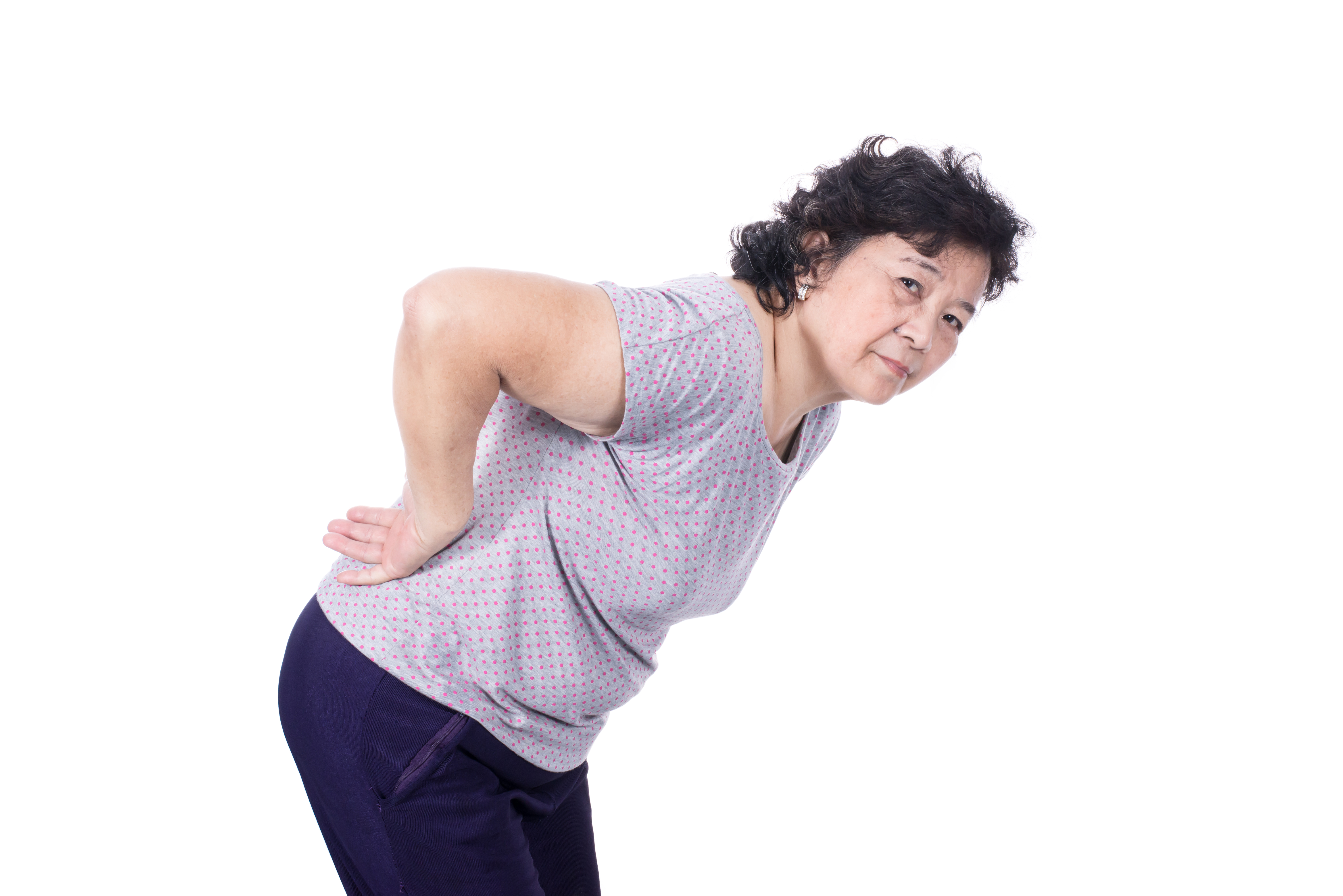 Asian elderly woman with a sick back, backache, isolated on a white background.