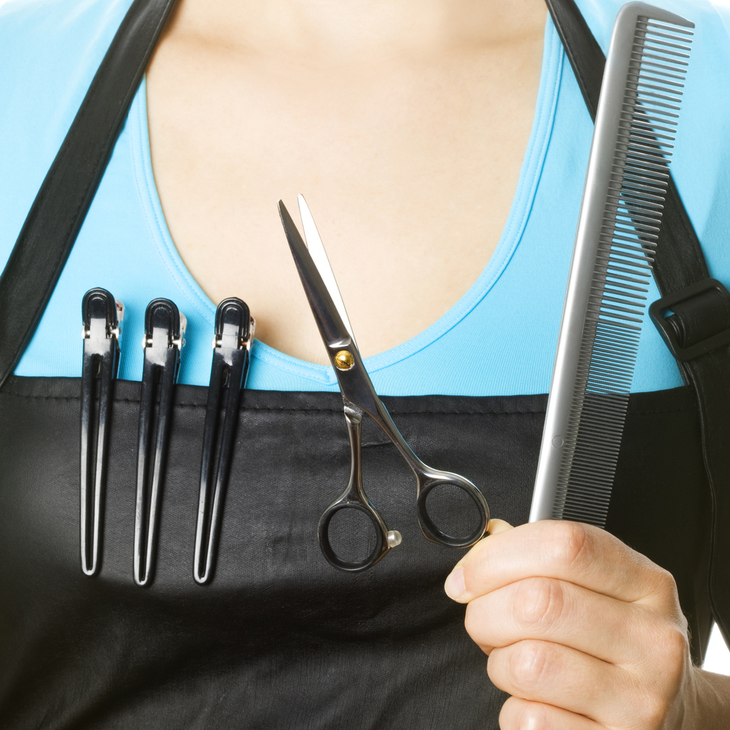 Hairdresser holding work tools