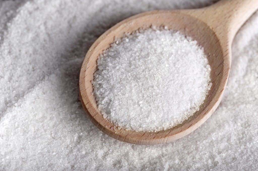 Salt/sugar on wooden teaspoon