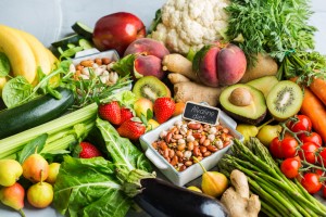 Balanced nutrition concept for clean eating alkaline diet. Assortment of healthy food ingredients for cooking on a kitchen table. Top view flat lay background