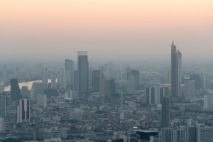 Concept of Pollution PM2.5 Unhealthy air pollution dust. Toxic haze in the city. Photos in the capital on a skyscraper.