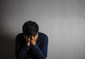 Man making facepalm gesture, sad and depression gesture