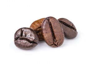 Two fresh roasted dark brown arabica coffee beans isolated on a white background with clipping path.