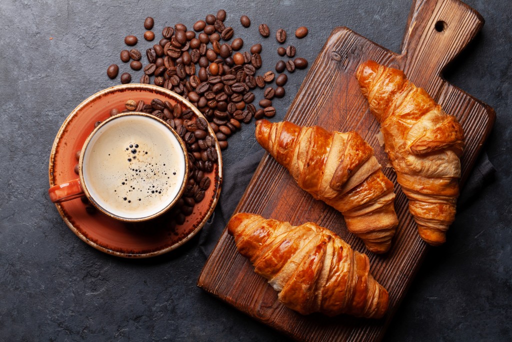 Espresso coffee and croissants for breakfast. Top view flat lay