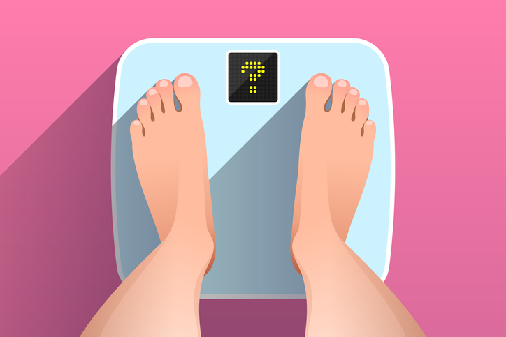 Woman is standing on bathroom scales with question mark on display, over pink background, top view of feet. Weight measurement and control. Concept of healthy lifestyle, dieting, weight loss or gain