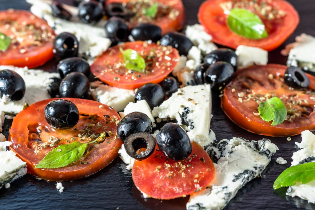 Vegetarian salad with tomatoes and feta, greek cuisine, mediterranean food