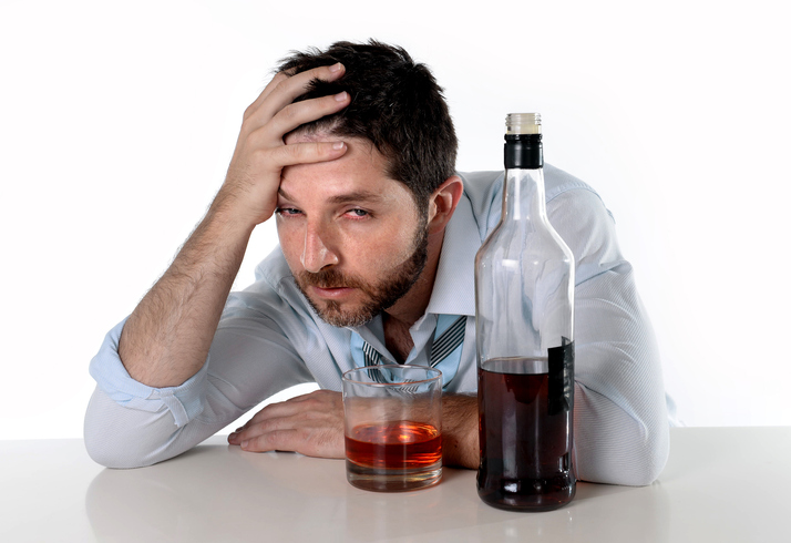 drunk business man wasted drinking whiskey in alcoholism