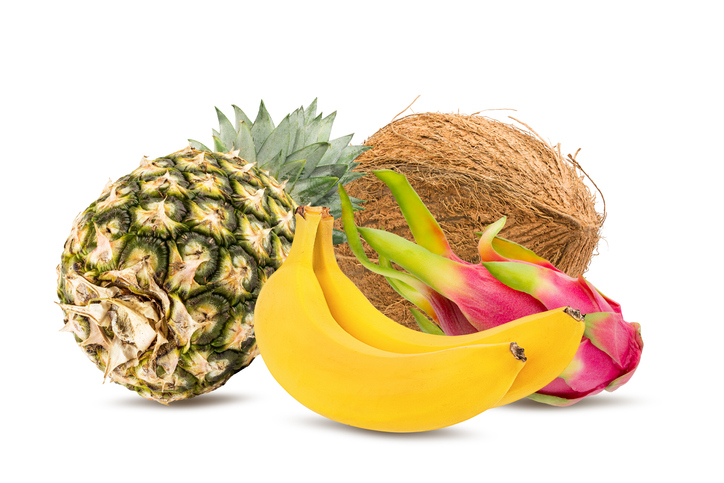 Exotic fruits coconut, dragon-fruit, pineapple and bananas isolated on white background